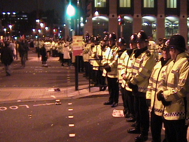 Police lineup greets protesters coming off Westminster Bridge