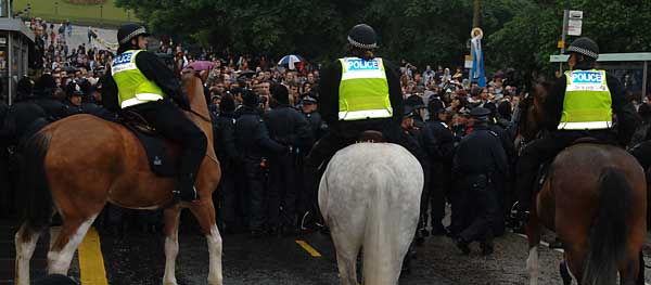 Mounted police push pen up the mound