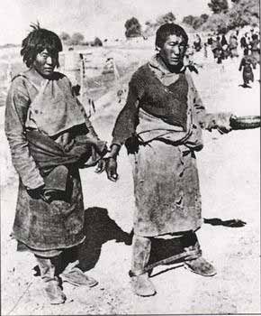 Tibetan slaves with fetters and handcuffs under the rule of Dalai Lama