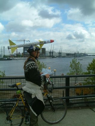One cyclist makes his point outside ExCel while pondering his next move
