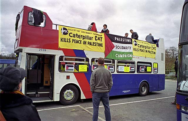 the open-top double-decker bus lead the protest motorcade