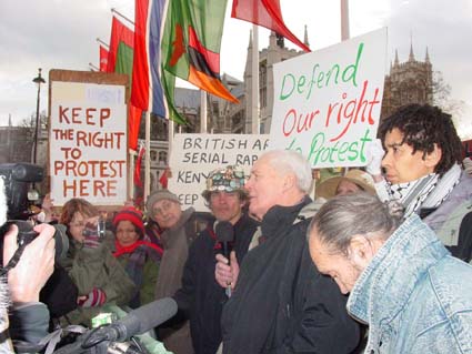 Angelica (red hat), with Brian Haw, Tony Benn (speaking) & others, Parliament Sq