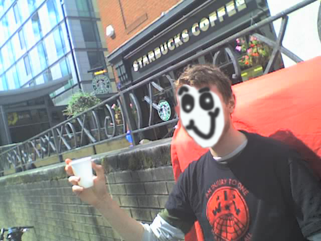 A wobbly enjoys a free, fair trade coffee in flagrant violation of police orders