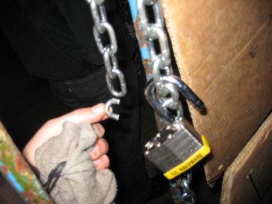 Broken chain after police forced entry