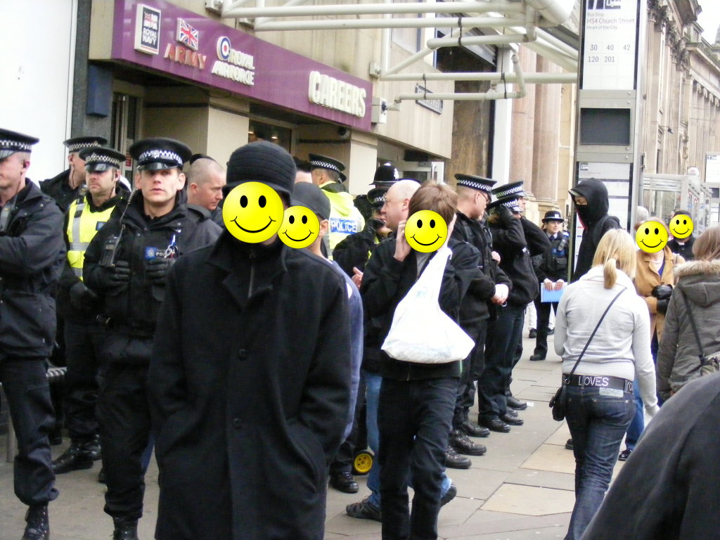 another shot of the police, faces obscured blaa blaa blaa