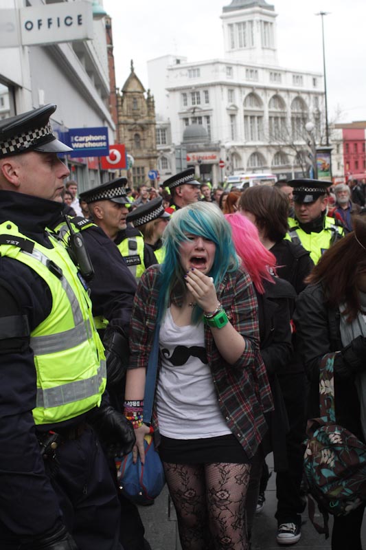 Girl got punched in the face by police and aren't allowed to leave the kettle