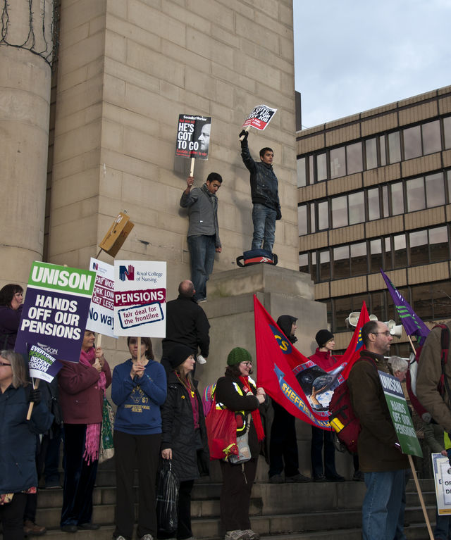 Cameron out!...Students climb city hall to make their point.